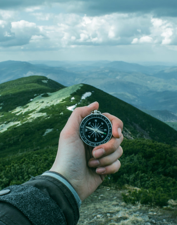 tourist holding a compass